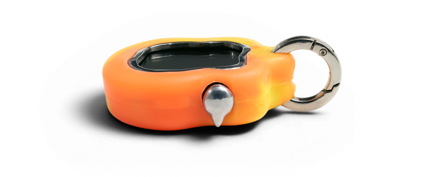 Side view of Amoeba One showing the steel bezel, screen, button, and keyring